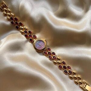 Gold and Red Gemstone Watch